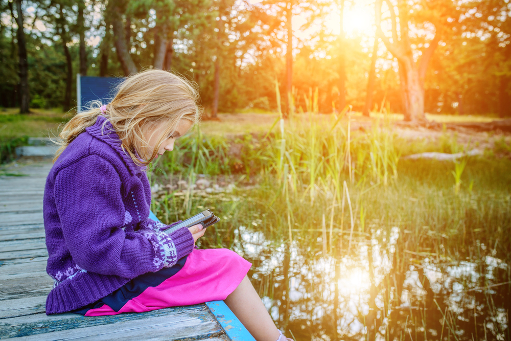 child reading kindle