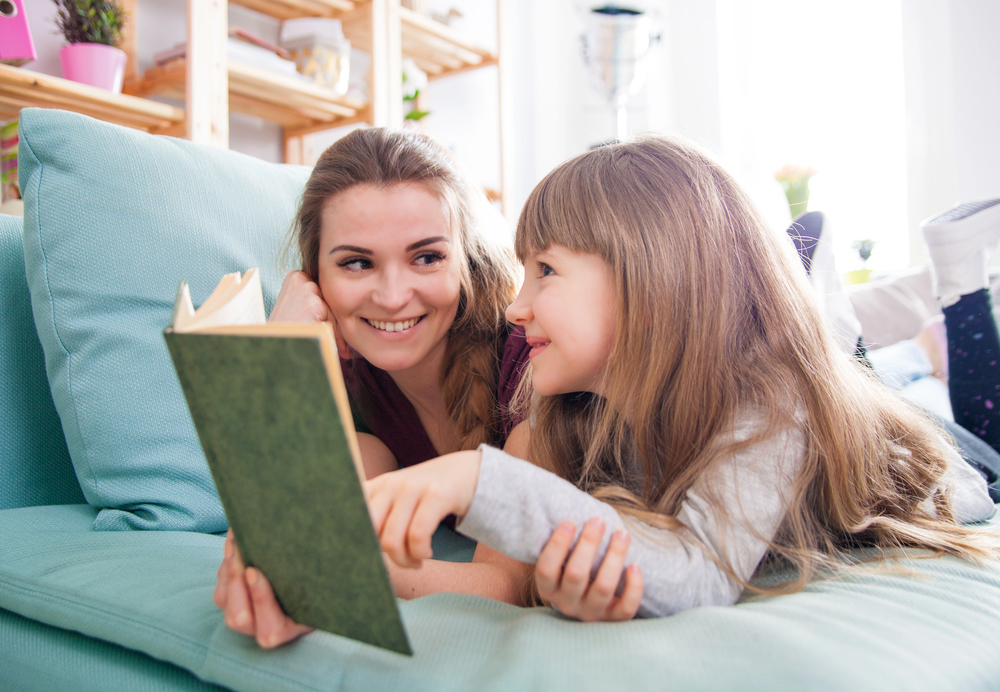 parent and child having fun reading