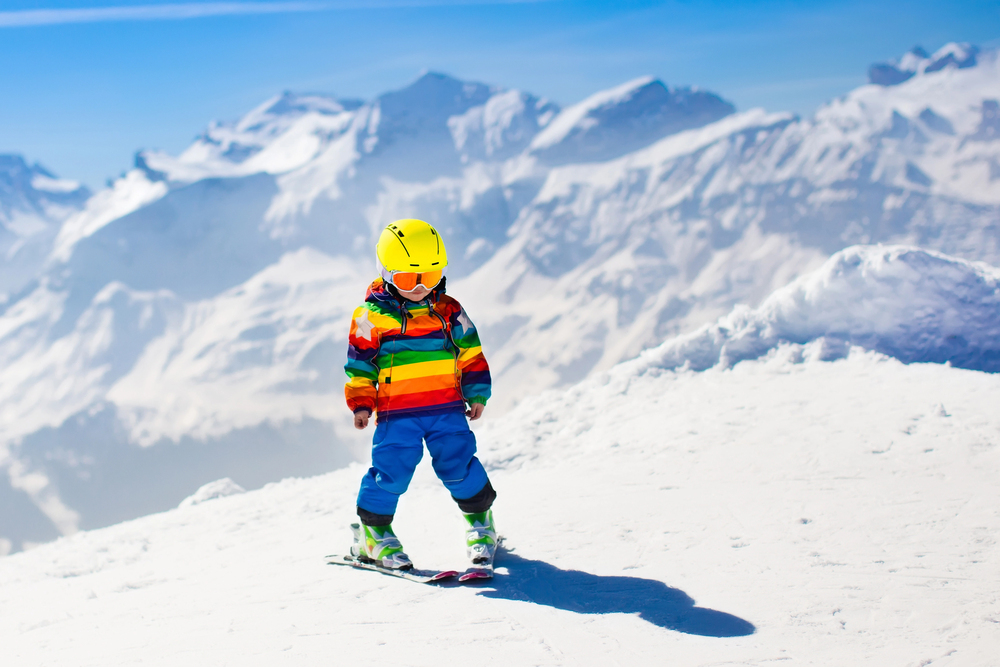 Little child skiing in the mountains